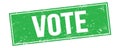 VOTE text on green grungy rectangle stamp