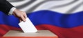 Voter Holds Envelope In Hand Above Vote Ballot On Russia Flag Background. Freedom Democracy Concept Royalty Free Stock Photo