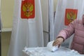 The Voter Holds The Envelope In His Hand Over The Ballot Background. The Concept Of Democracy Freedom .