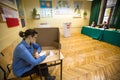 Voter at the polling station during polish parliamentary elections to both the Sejm and Senate.