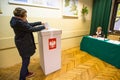 Voter at the polling station during polish parliamentary elections to both the Sejm and Senate.