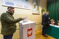 Voter at the polling station during polish parliamentary elections to both the Sejm and Senate.