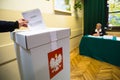 Voter at the polling station during polish parliamentary elections to both the Sejm and Senate.