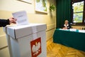 Voter at the polling station during polish parliamentary elections to both the Sejm and Senate.