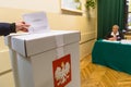 Voter at the polling station during polish parliamentary elections to both the Sejm and Senate.