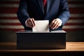 Voter putting voting paper in ballot box during elections. Election voting concept. Royalty Free Stock Photo