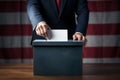 Voter putting voting paper in ballot box during elections. Election voting concept.