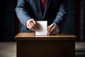 Voter putting voting paper in ballot box during elections. Election voting concept. Royalty Free Stock Photo