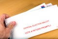 Voter receiving ballot in mail Royalty Free Stock Photo