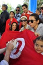 Voters with tunisian red flag waiting to vote