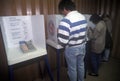 Voters and voting booths in a polling place