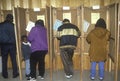 Voters and voting booths in a polling place, CA Royalty Free Stock Photo