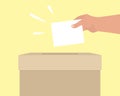 Voting concept. A human hand puts an envelope in ballot box. Template with empty paper for text. Referendum, voting, presidential