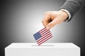 Voting concept - Man inserting flag into ballot box - United States Royalty Free Stock Photo