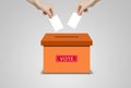Many hands holding white blank paper and putting voting paper in ballot voting box. Royalty Free Stock Photo