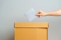 Voting and Democracy concept. Man hand putting ballot in election box, Democracy referendum for government, President and Prime Royalty Free Stock Photo