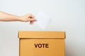 Voting and Democracy concept. Man hand putting ballot in election box, Democracy referendum for government, President and Prime Royalty Free Stock Photo