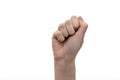 Voting right. Feminism. Female fist up. Gesture with a fist. Woman holds a secret in her hand on a white background Royalty Free Stock Photo