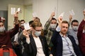 Voting at Yabloko party conference, coronavirus COVID 19 protection respiratory mask