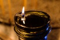 A votive candle flame burns brightly in a Mykonos Chapel Royalty Free Stock Photo