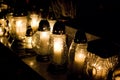 Votive candles burning on a cemetery. Royalty Free Stock Photo