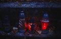 Votive candles lantern burning on the graves in Slovak cemetery at night time. All Saints\' Day. Solemnity of All Saints Royalty Free Stock Photo