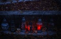 Votive candles lantern burning on the graves in Slovak cemetery at night time. All Saints\' Day. Solemnity of All Saints Royalty Free Stock Photo