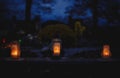 Votive candles lantern burning on the graves in Slovak cemetery at night time. All Saints\' Day. Solemnity of All Saints Royalty Free Stock Photo