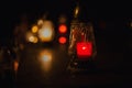 Votive candles lantern burning on the graves in Slovak cemetery at night time. All Saints\' Day. Solemnity of All Saints Royalty Free Stock Photo