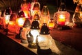 Votive candles lantern burning on the graves in Slovak cemetery at night time. All Saints' Day. Solemnity of All Saints Royalty Free Stock Photo