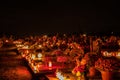 Votive candles lantern burning on the graves in Slovak cemetery at night time. All Saints' Day. Solemnity of All Saints