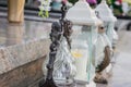 Votive candles lantern on the grave in Slovak cemetery. All Saints' Day. Solemnity of All Saints. All Hallows eve