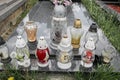 Votive candles lantern on the grave in Slovak cemetery. All Saints' Day. Solemnity of All Saints. All Hallows eve