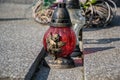 Votive candles lantern on the grave in Slovak cemetery. All Saints' Day. Solemnity of All Saints. All Hallows eve Royalty Free Stock Photo