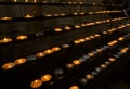 votive candles lit by the faithful after reciting a prayer inside the Church Royalty Free Stock Photo