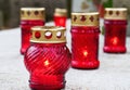 Votive candles, memorial candles light on grave