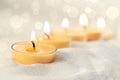 Votive candles in sand