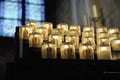 Votive Candles with stained glass window in background, Notre Dame Cathedral, Paris, ÃÅ½le-de-France Royalty Free Stock Photo