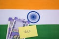 Political corruption in India and concept the purchase of votes in elections on indian flag.