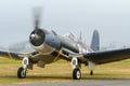 An F4U Corsair fighter plane on the ground