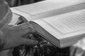 VOYUTYN, UKRAINE - 14 October 2008: Hands of priest on the Bible. Shallow depth of fielf