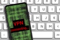 vpn connecting word and Hacker icon in mobile phone with digital code numbers