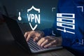 VPN secure connection concept. Person using Virtual Private Network technology on laptop computer to create encrypted tunnel to
