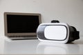 VR box placed on a white desk with a laptop in the training room..The concept: technology virtual reality ai digital modern and Royalty Free Stock Photo