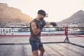 VR boxing, metaverse fitness and man with innovation sports training for wellness in city, digital futuristic 3d workout