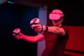 Vr game and virtual reality. man gamer fun playing on futuristic simulation video shooting game in 3d glasses and joysticks gun in Royalty Free Stock Photo