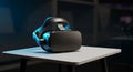 A VR headset rests on a small square table. The headset features a sleek, dark design Royalty Free Stock Photo