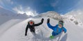 VR360: Smiling snowboarder couple high fives while hiking up untouched mountain. Royalty Free Stock Photo