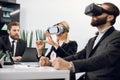 VR, technology and business concept. Team of three professional male and female designers or architects, wearing vr Royalty Free Stock Photo