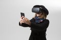 Woman uses a virtual reality glasses. VR 360. Virtual game.